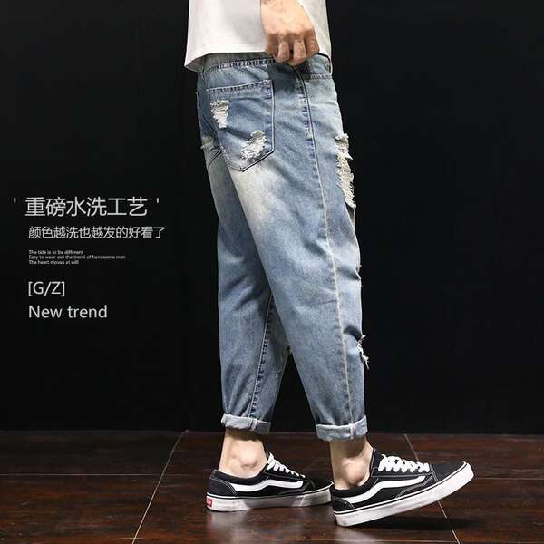Calça jeans rasgada larga masculina