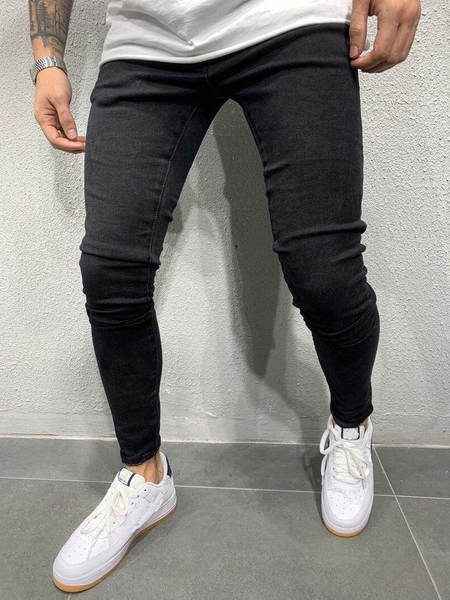 Jovens europeus e americanos de alta qualidade com as pernas apertadas de jeans independentes de comércio exterior