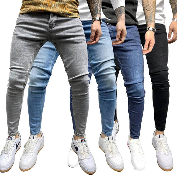 Jovens europeus e americanos de alta qualidade com as pernas apertadas de jeans independentes de comércio exterior