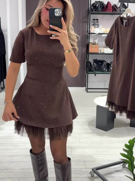O novo vestido da Amazon para o ano de 2026 é um casaco curto.