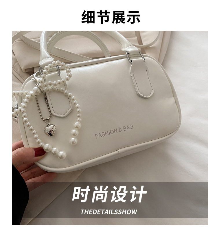 Bolsa feminina de ombro com laço de pérola
